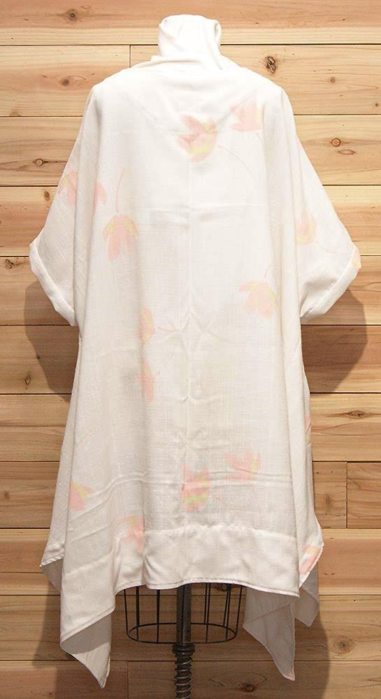 Chic white Italian linen cloak with pink flowered print and front pockets.