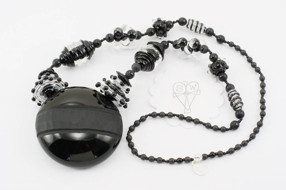 necklace with deep black and crystal clear glass beads