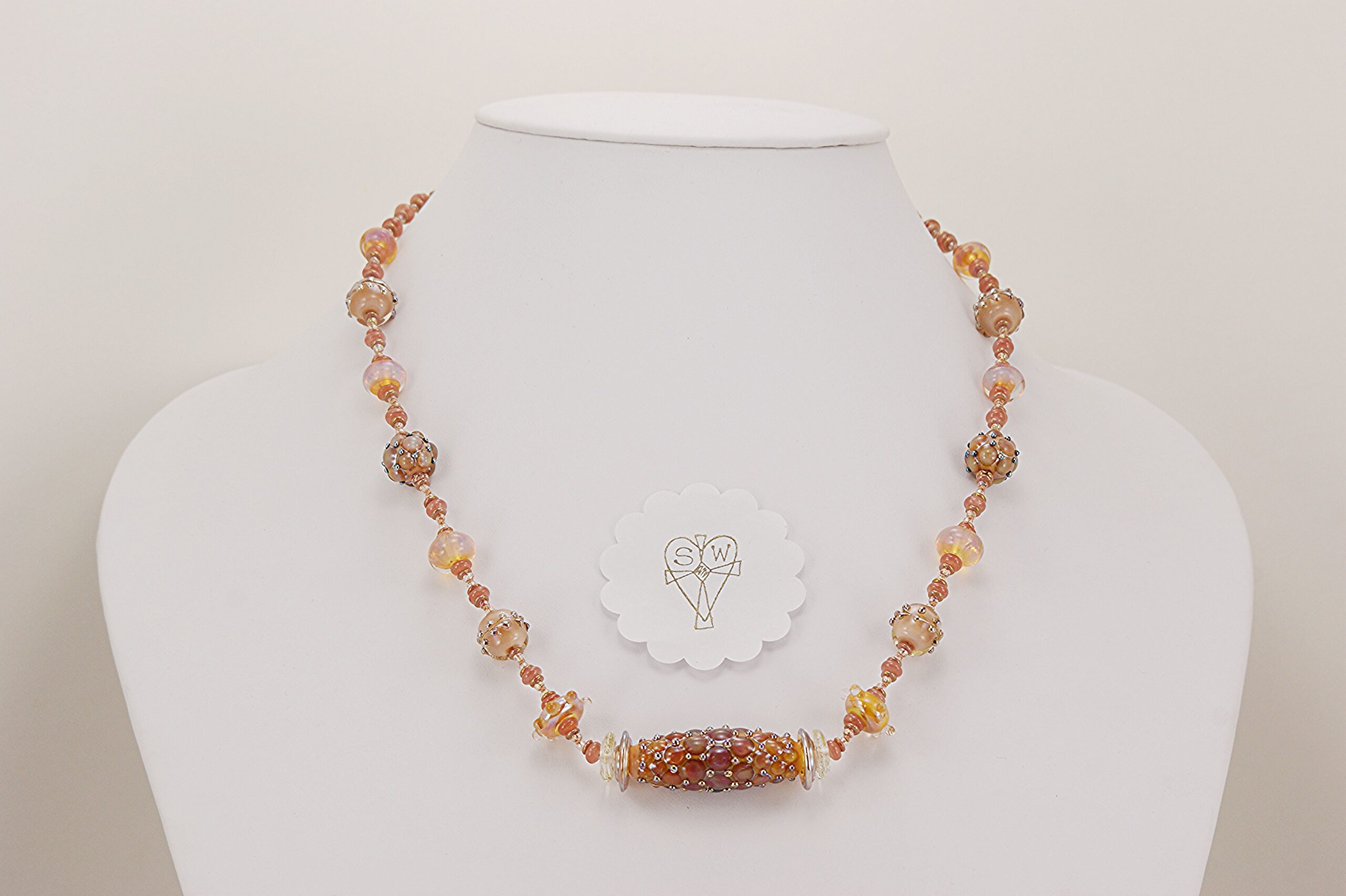 peachy colored glass bead necklace