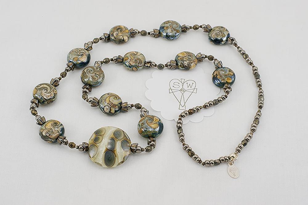 Grey and ivory colored glass bead necklace.