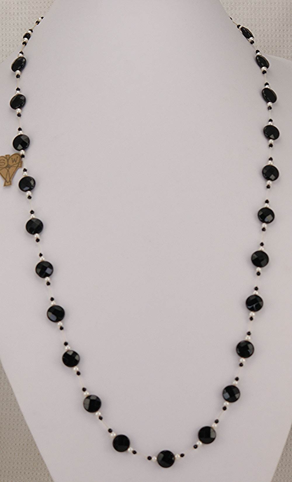 Necklace made with black faceted spinel beads and freshwater pearls.