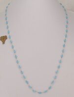 31 inch long, light blue bead necklace.