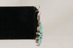 Turquoise and sterling silver flower earring side view.