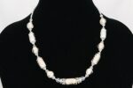 White glass bead necklace with moonstone, opal, glass seed beads.