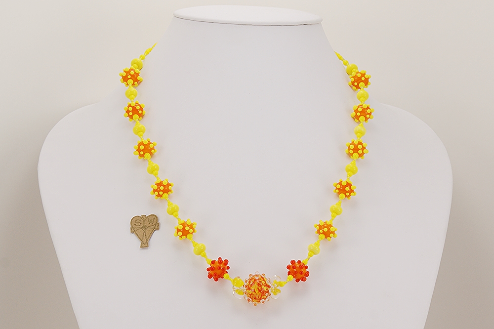 Bright orange and yellow glass bead necklace.