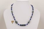 Cobalt blue colored glass bead necklace with silver metallic effect.