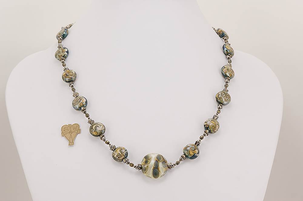 Grey and ivory colored glass bead necklace.