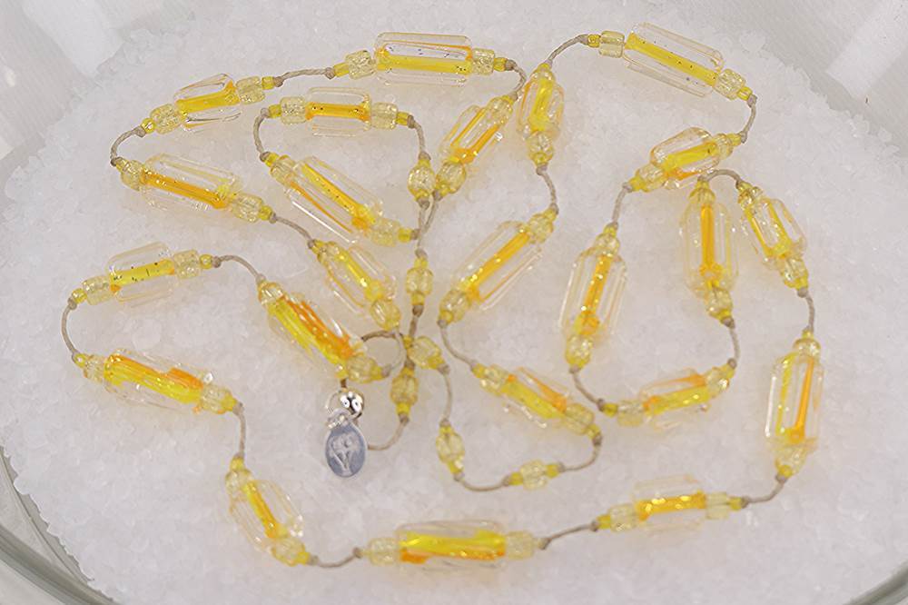 Bright yellow and orange glass beaded necklace.