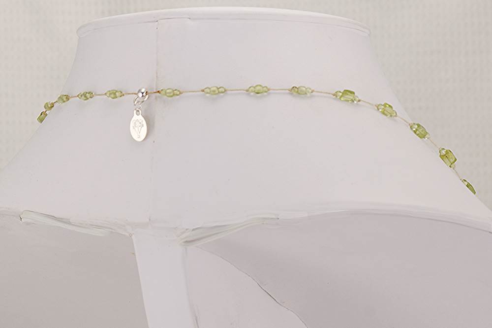 Chrysolite stone slab necklace with peridot round beads.