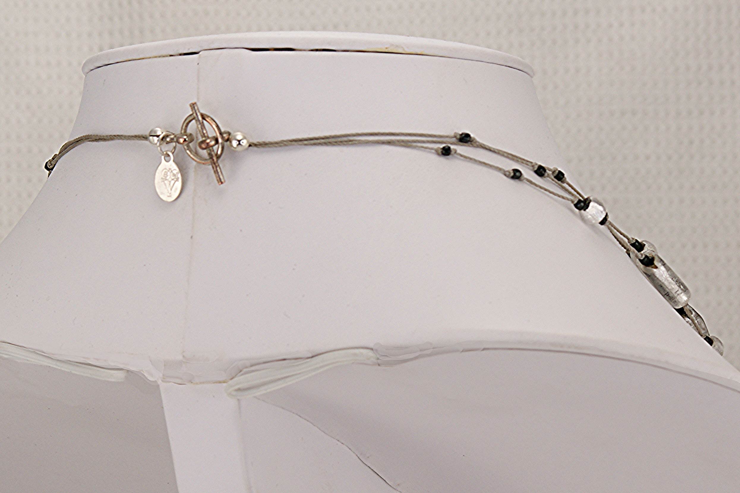 Silver gilded, black and clear glass beaded necklace.