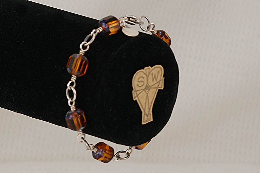 Topaz colored, copper flashed, glass bead bracelet with sterling silver.