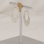 Handmade sterling silver scroll cut earrings.