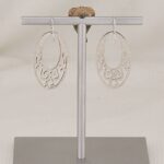 Handmade, oval scroll cut sterling silver earrings.
