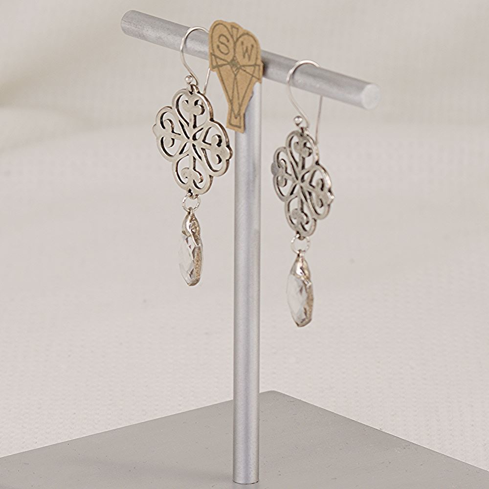 Quatrefoil earrings made of scroll cut pure sterling silver and quartz crytsals.