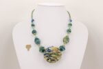 necklace with ocean hued colored glass beads in blues greens,turquoise and soft beige