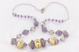 Lavender glass beaded necklace with 22 karat gold and sterling silver accents.