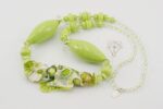 Necklace made from lime green and ivory colored Italian Murrini glass beads.