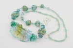 necklace with ocean colored glass beads accented with silver and gold dust