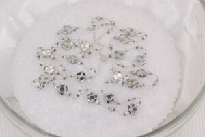 Silver reflective glass bead necklace with mercury beads.