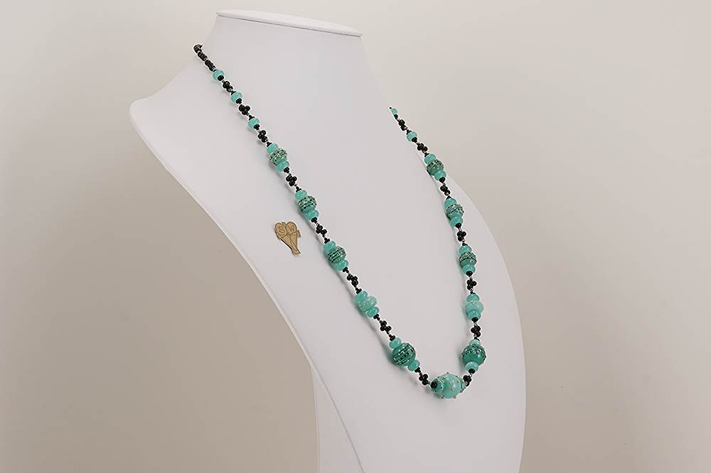 Kryptonite foam green colored glass bead necklace with sterling silver dotted accents and black spinel beads.