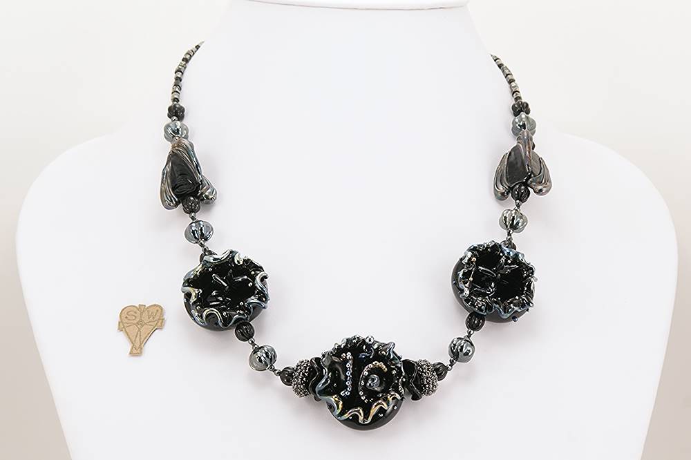Necklace with black and sterling silver accented glass beads.