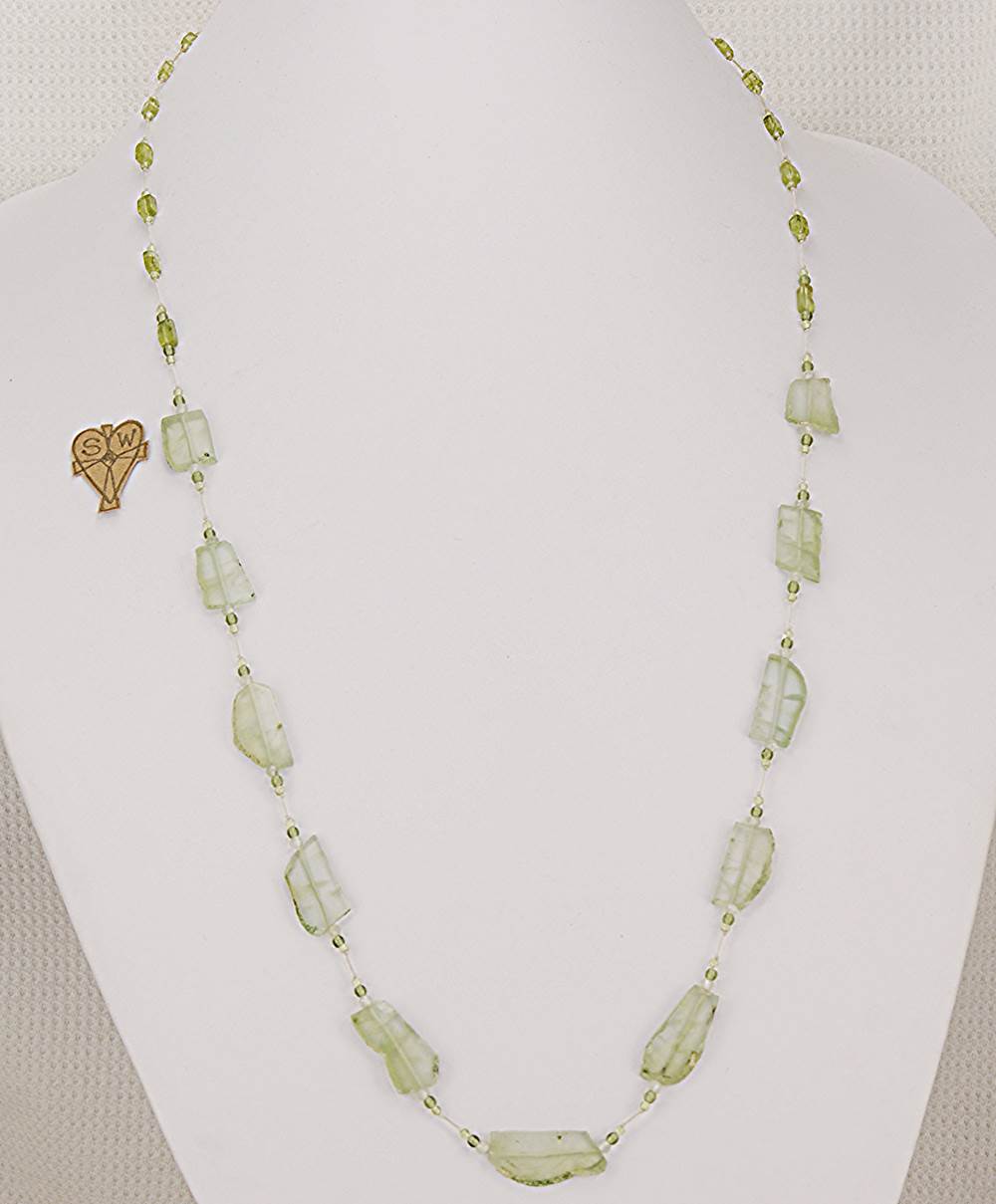 33 inch long necklace made of raw chrysolite stone slabs and peridot beads.