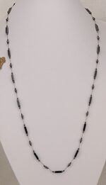 Necklace made of polished hematite bars, rondels and round beads.