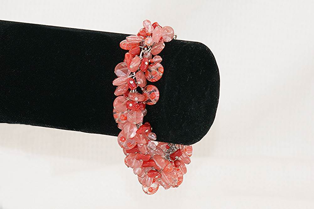 Bracelet handmade with natural red bamboo coral, rose quarts, millefiori murano glass beads and sterling silver.