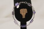 One of a kind, purple , glass bead bracelet, hand wrapped with sterling silver.