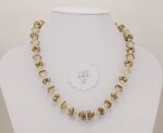ivory colored glass bead necklace with sterling silver accents