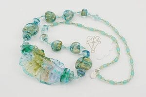 necklace with ocean colored glass beads accented with silver and gold dust