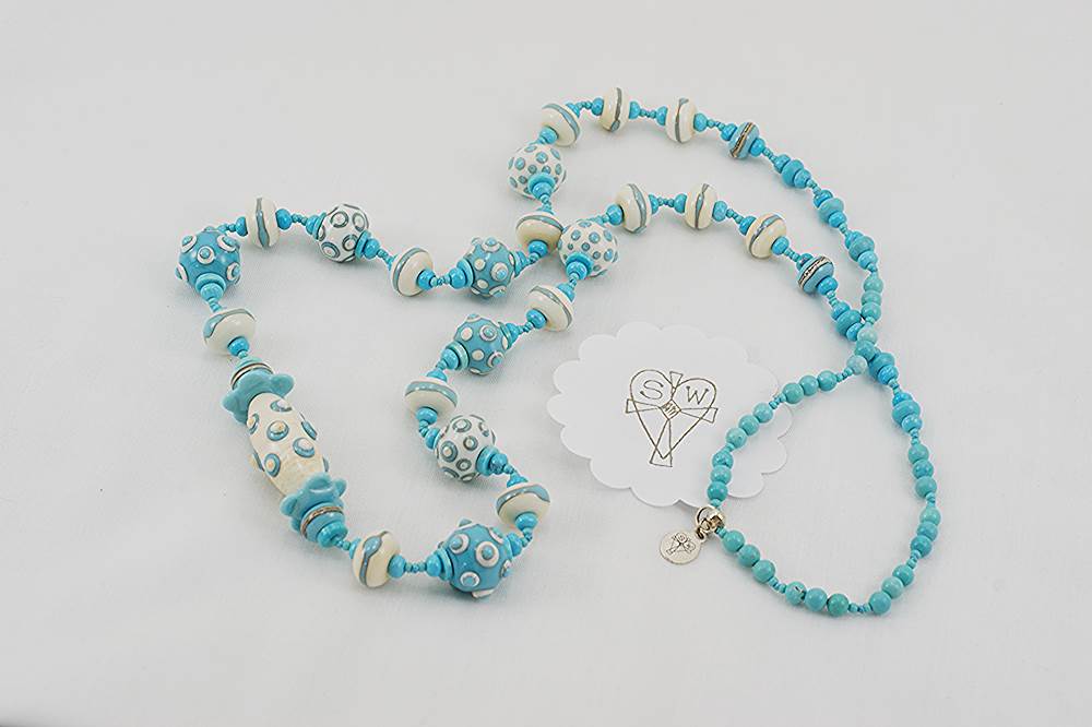 necklace with turquoise and ivory colored glass beads.