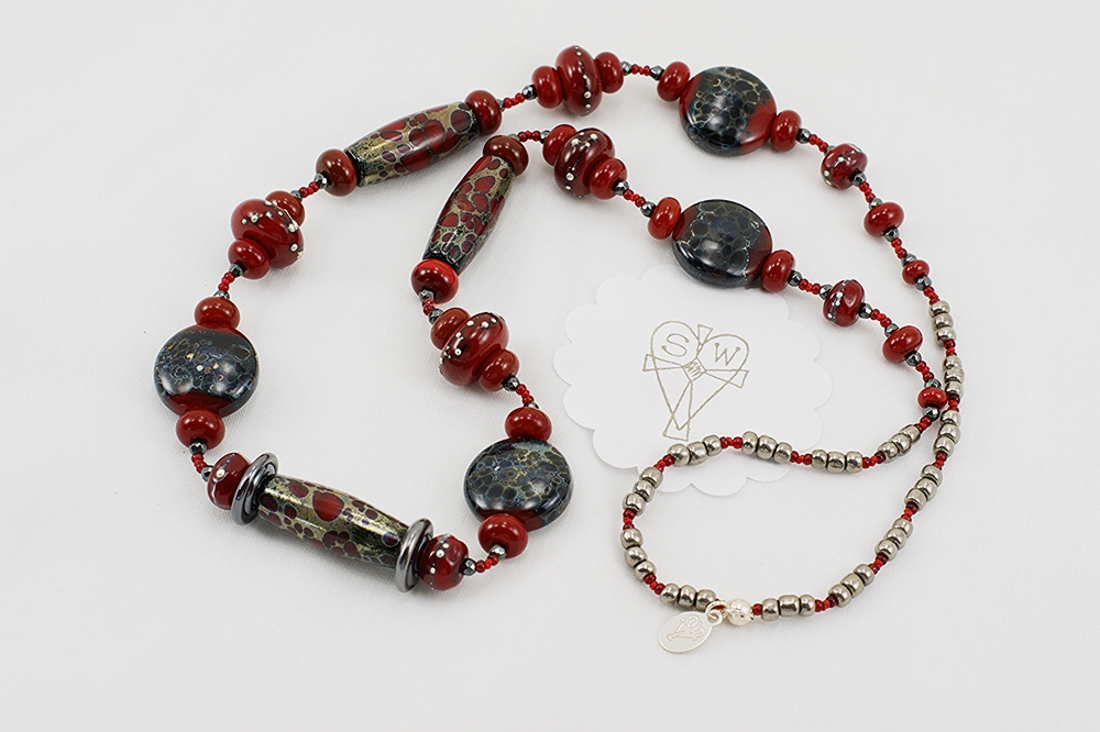 Red, black and grey glass bead necklace with silver raku effect.