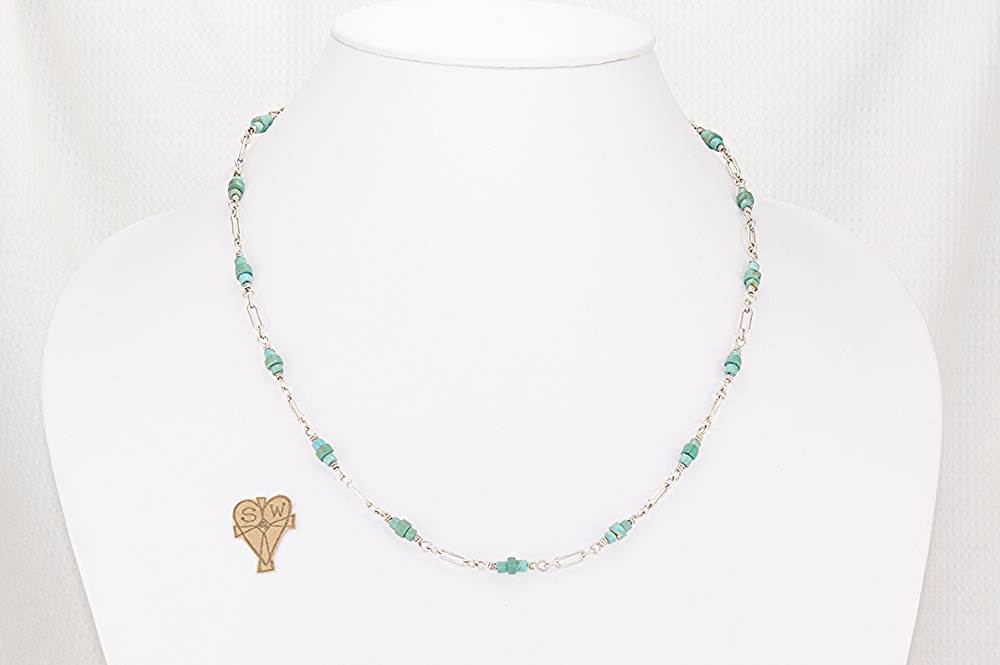 One of a kind, hand wrapped, turquoise and sterling silver necklace.