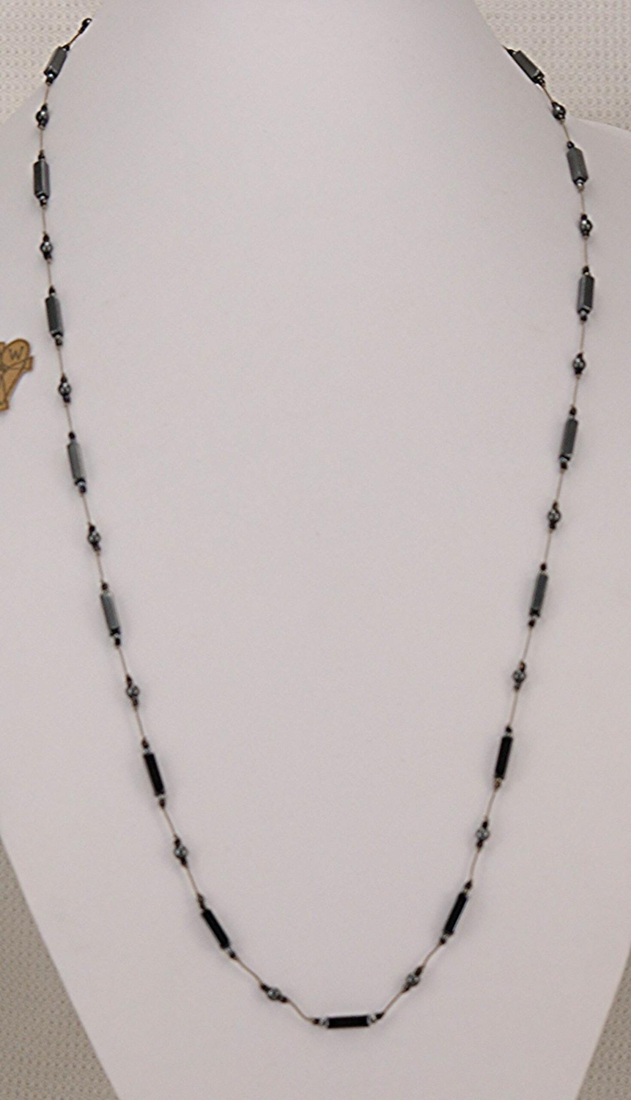 Necklace made of polished hematite bars, rondels and round beads.