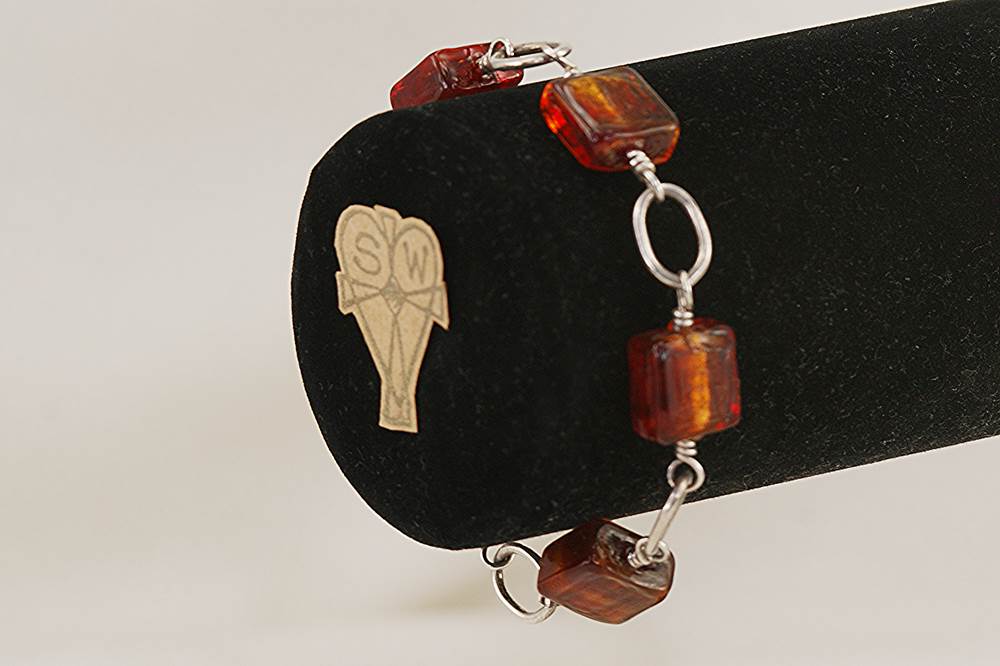 Burnt orange , Venetian dichroic glass bead bracelet with sterling silver.