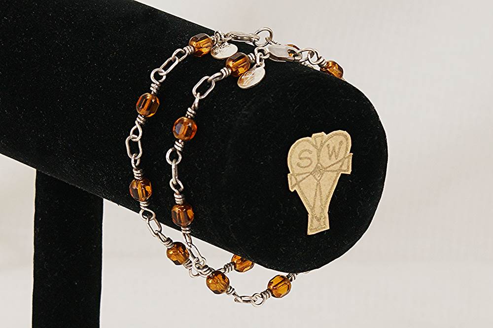 2 piece bracelet set made of copper colored glass beads and sterling silver.