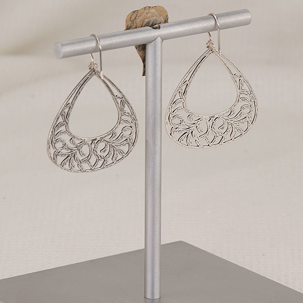 Earrings handmade of scroll cut and chased sterling silver.
