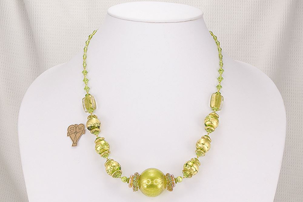 Elegant, one of a kind hand blown green and gold glass bead necklace.