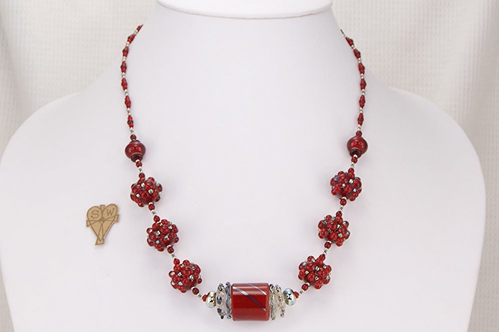 Unique red and sterling silver glass bead necklace.
