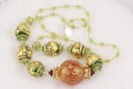 One of a kind red green and gold blown glass necklace.