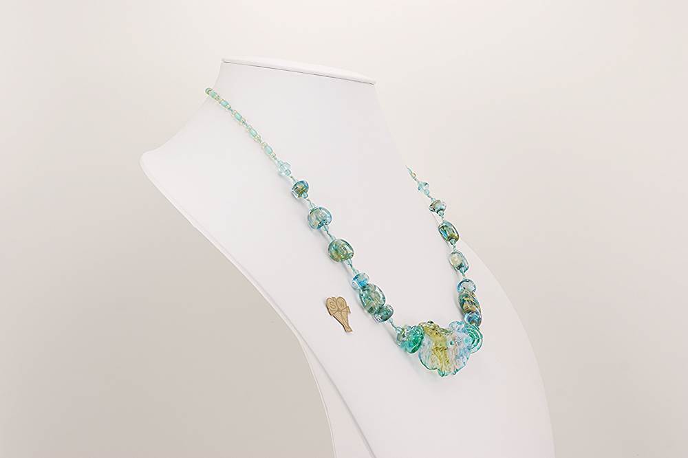 Necklace handmade with blue ocean colored glass beads sparkling with real silver and gold flashing.