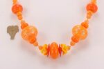 Bright orange glass beaded necklace.