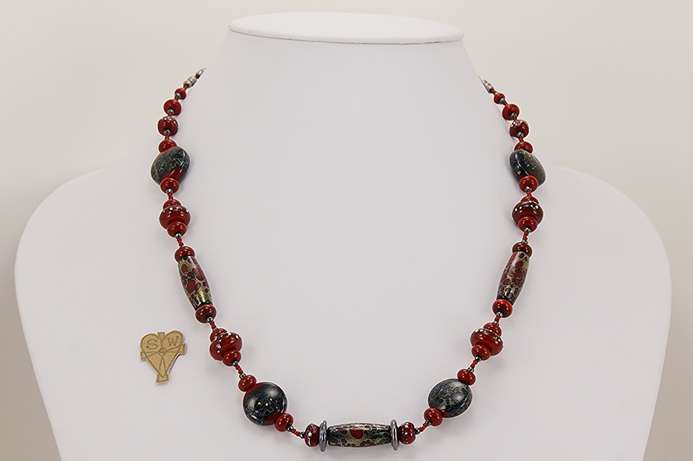 Red, black and grey glass beaded necklace with sterling silver accents.