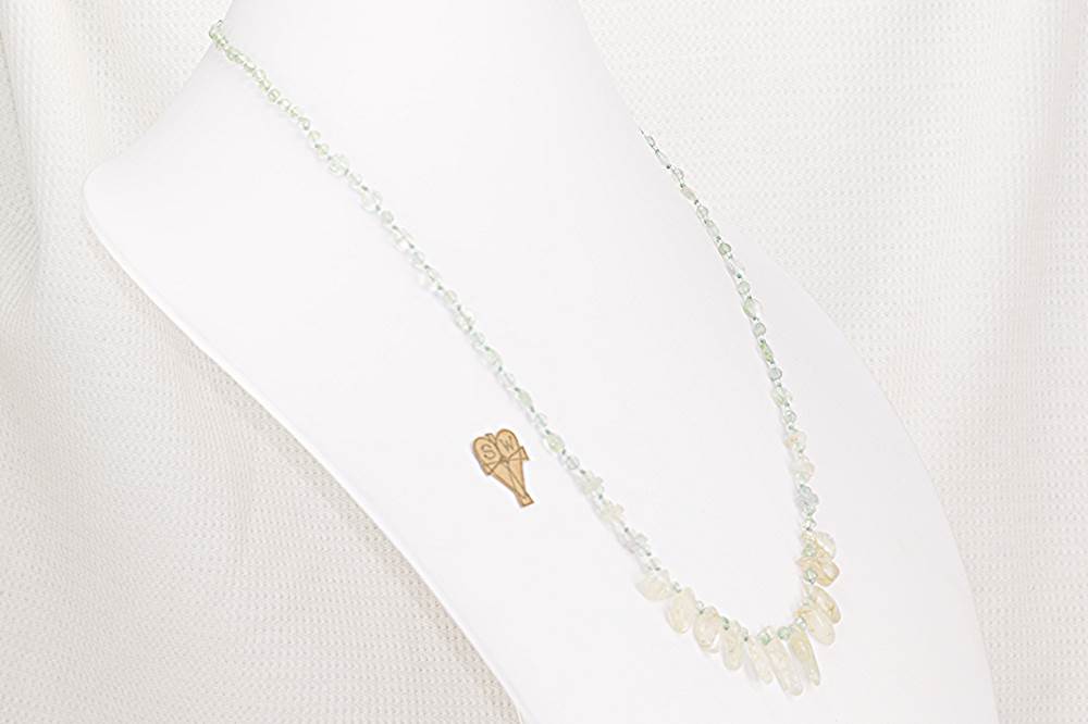 Handmade, faceted, green moss agate and rutilated quartz necklace.