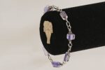 Purple glass bead bracelet with sterling silver.