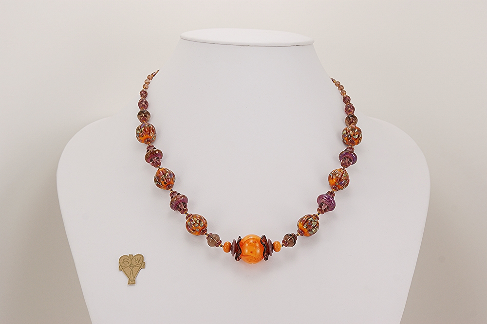 orange and amethyst colored glass bead necklace