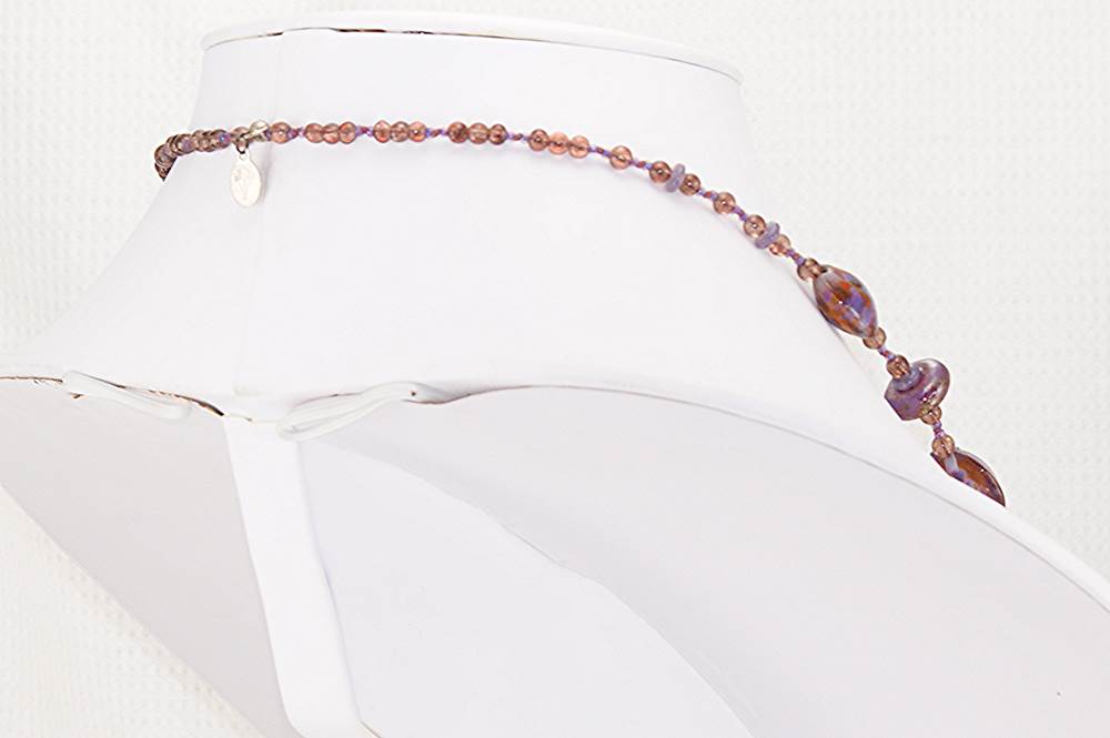 Raspberry and purple colored necklace with sterling silver accents.