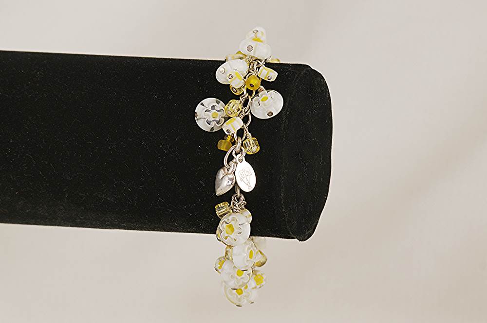 Handmade, sterling silver bracelet with lemon yellow, Venetian, millefiori and Japanese crackle barrel beads.