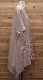 Chic cloak made of Australian linen with Pale pink an mauve flowered print and two large front pockets.